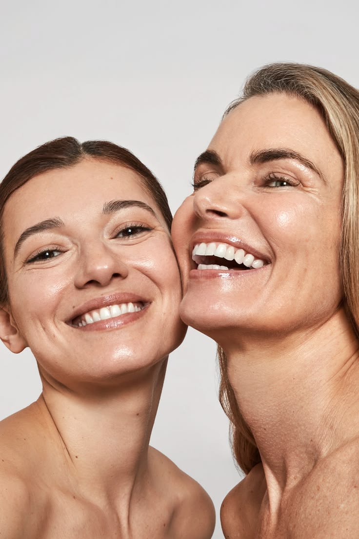 Two smiling women celebrating radiant skin